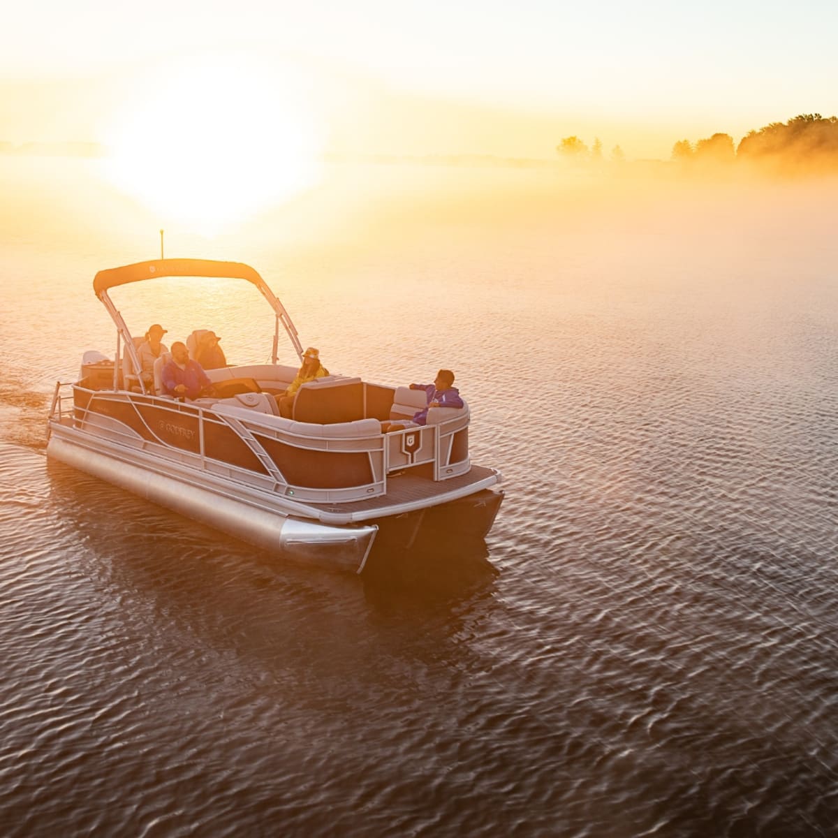 Pontoon on the lake in Magog at sunset.