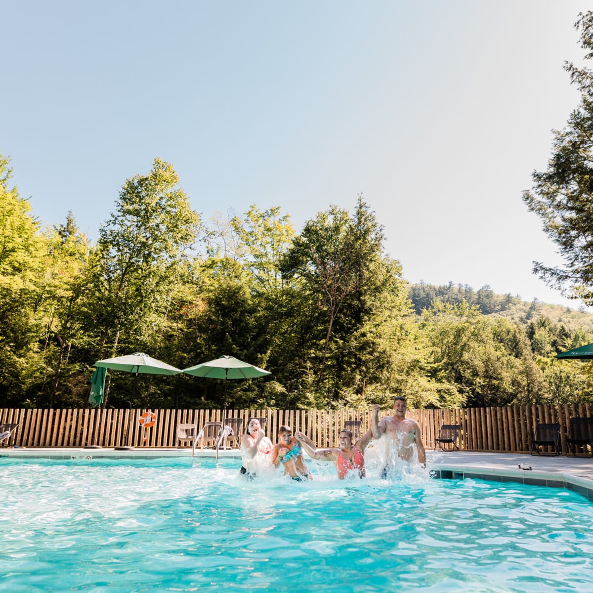 Family in a pool at Huttopia Sutton. 