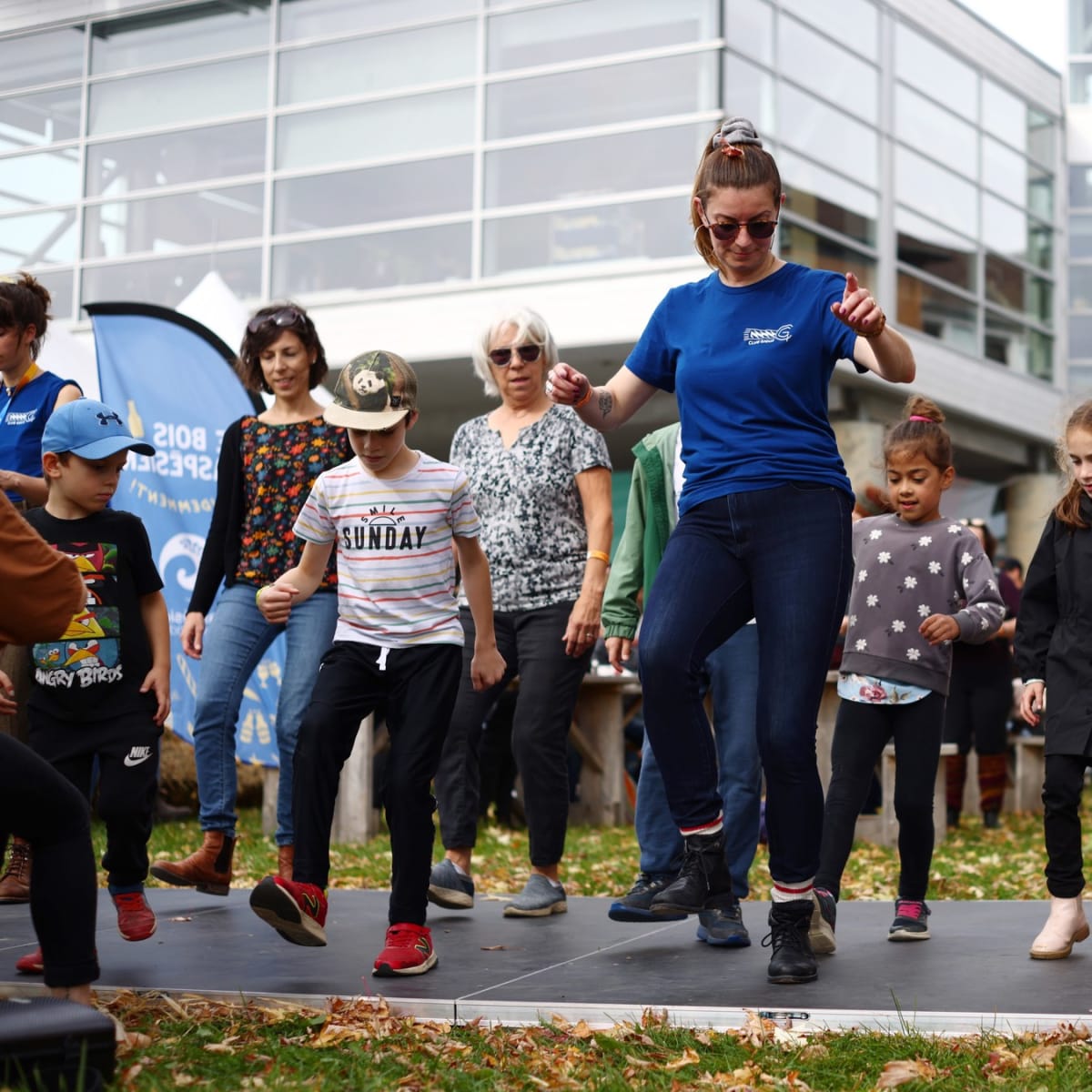 Group of kids learning a dance.