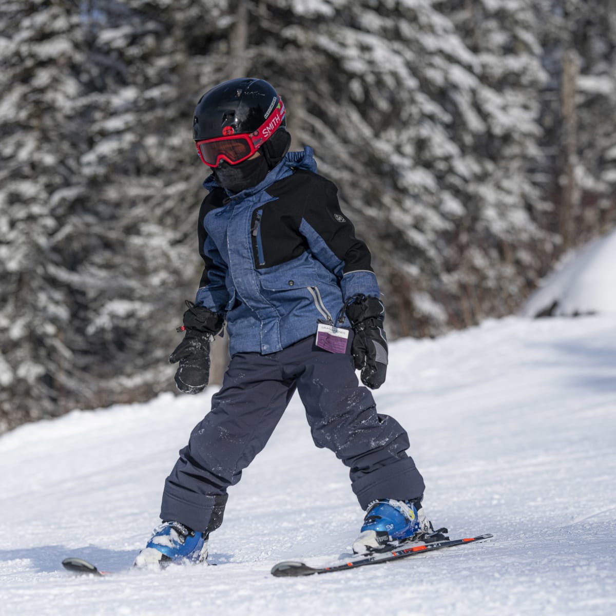 Child learning to ski.
