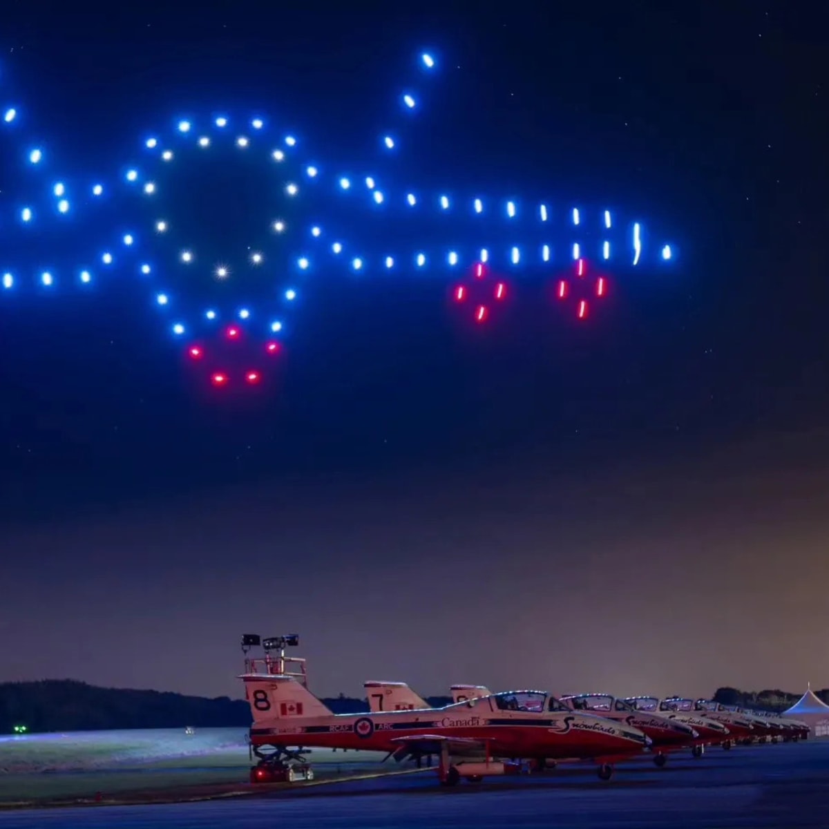 AERO Gatineau-Ottawa Airshow - Illuminated drones form a plane in the sky.