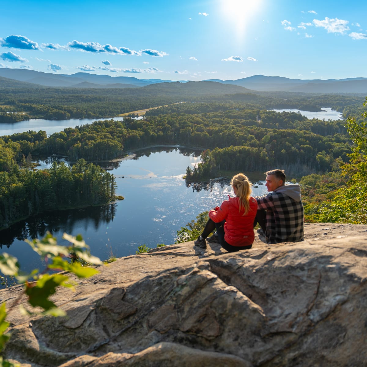 Two people on top of a mountain in Saint-Donat.