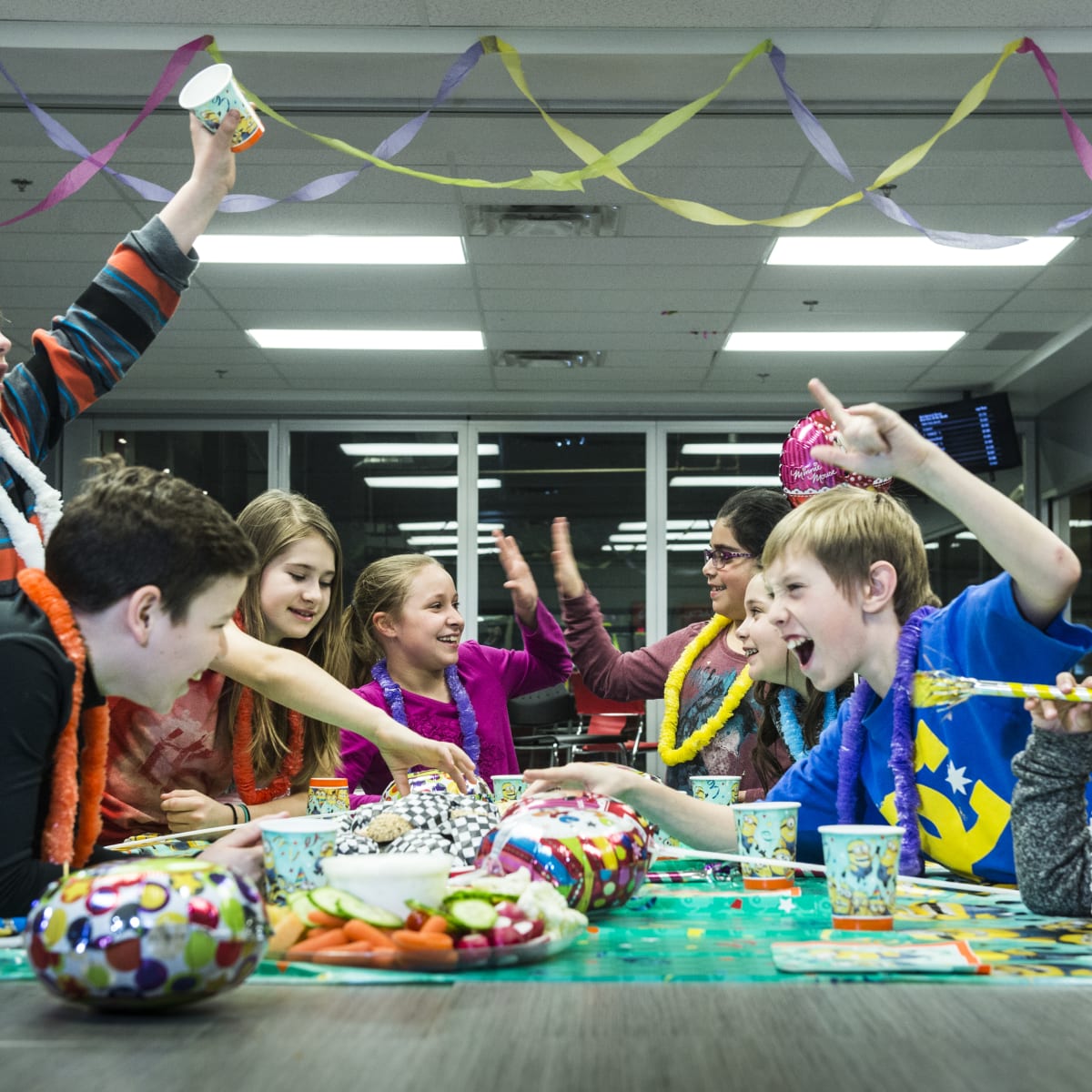 Group of kids at a birthday party.