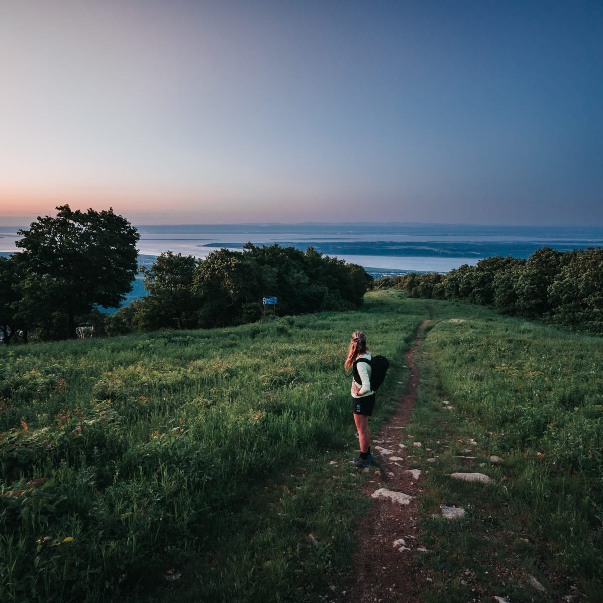 Woman on sentier La Crête at dusk at Mont Sainte-Anne.