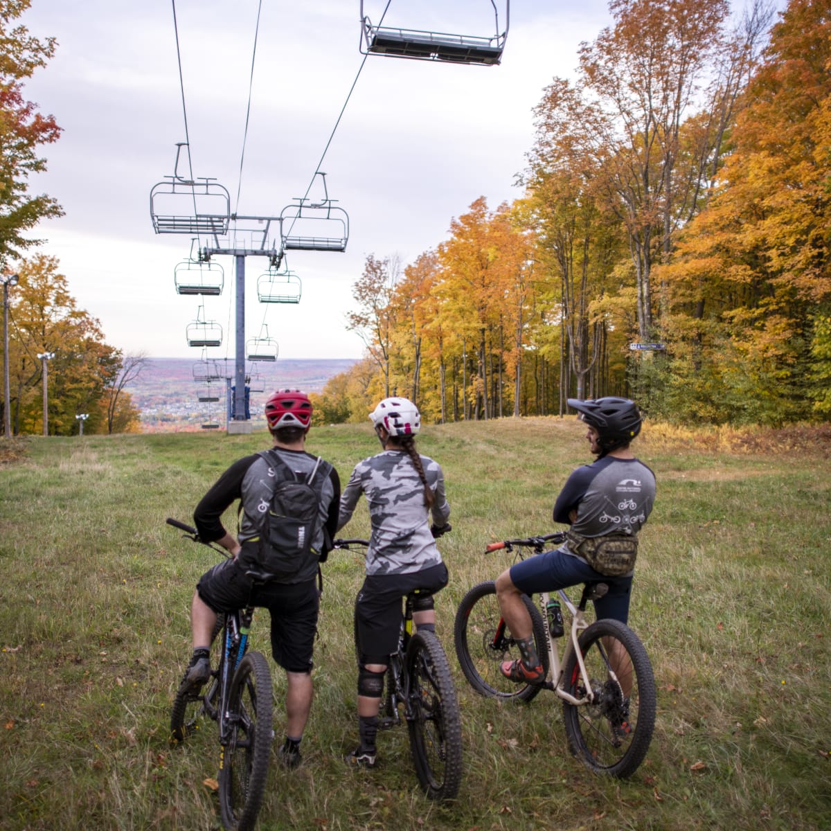 3 cyclists on a mountain.