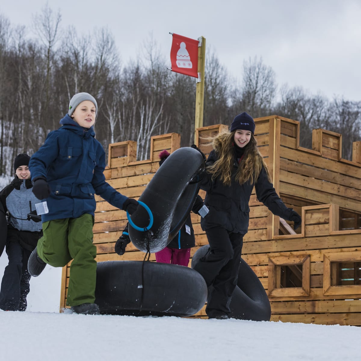 Kids going snow tubing.