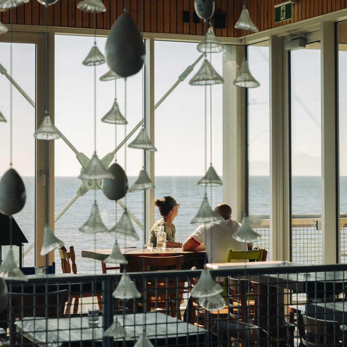 Interior of a restaurant by the water.