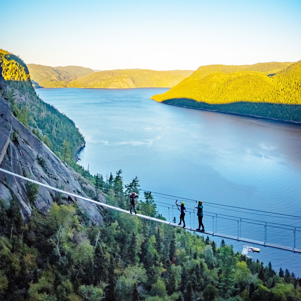 Aerial view of a via ferrata, with the Saguenay Fjord in the background.