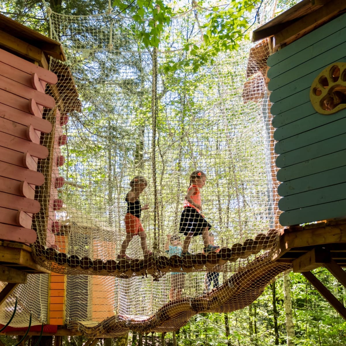 Two kids at Village Arbre-en-Ciel at Arbraska Rawdon.