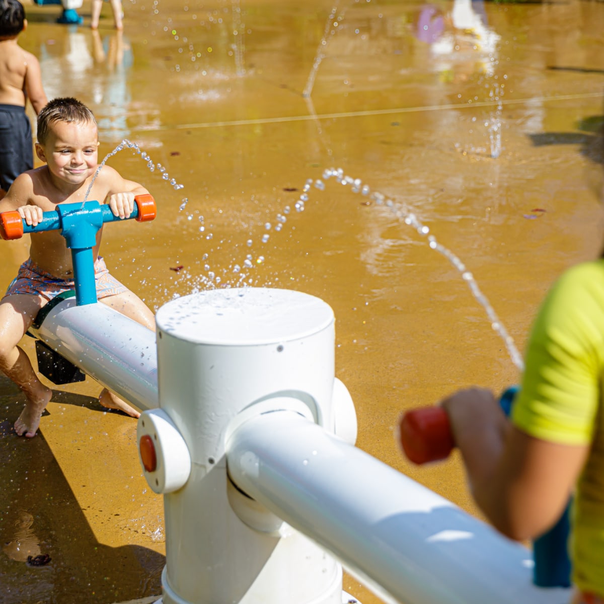 Toddler and mother in the water games