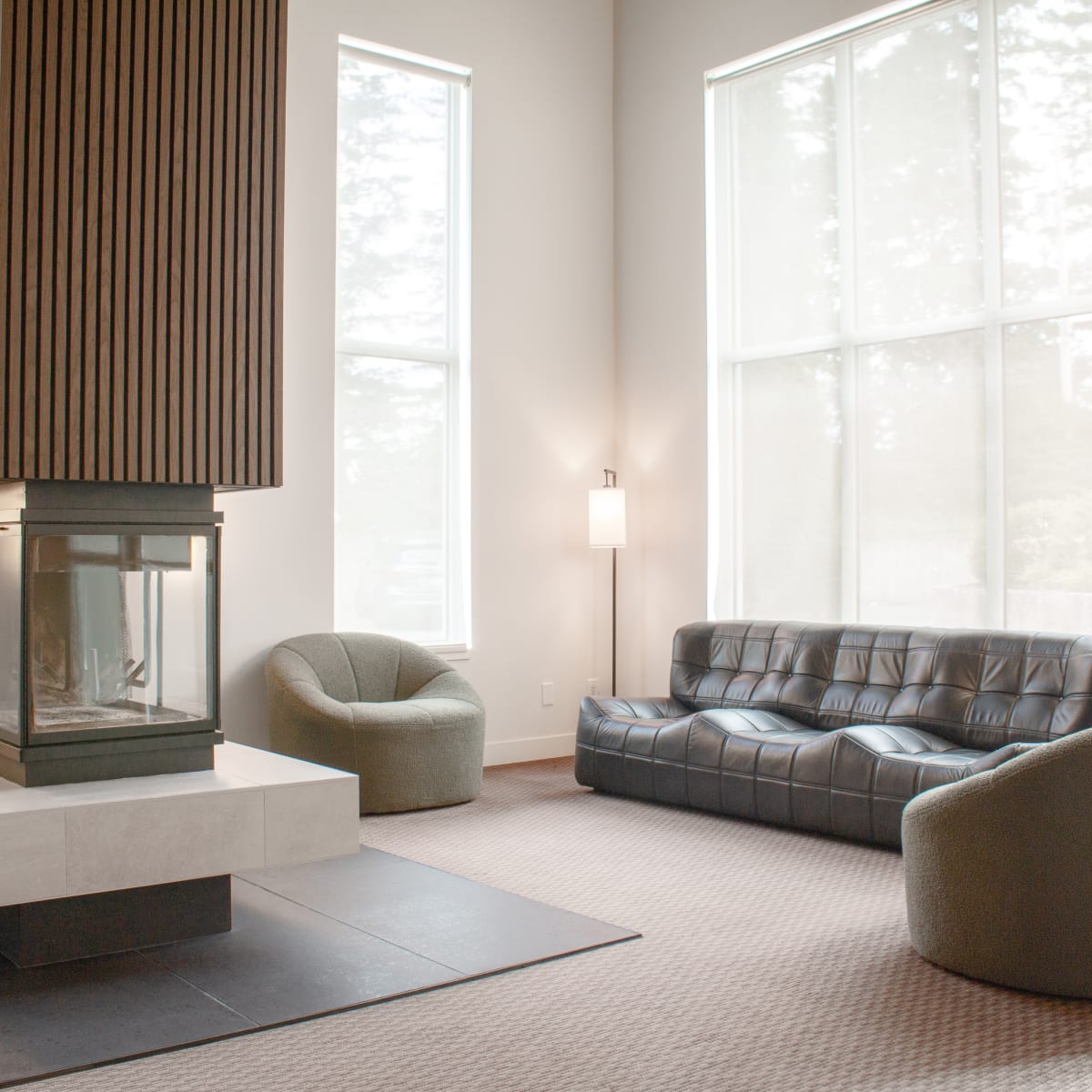 Lobby with fireplace and sofa at Auberge Matha.