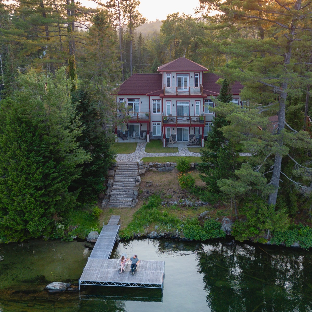 Aerial view of the inn and the lake on a summer evening.