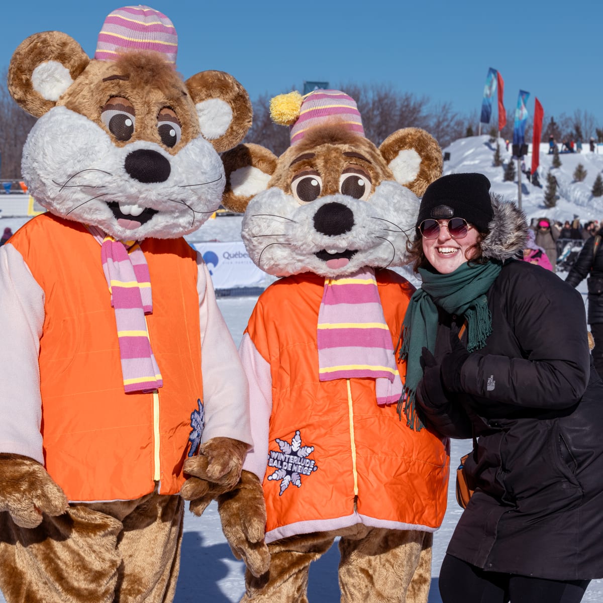 Winterlude - Snowflake kingdom - Woman standing with two mascots