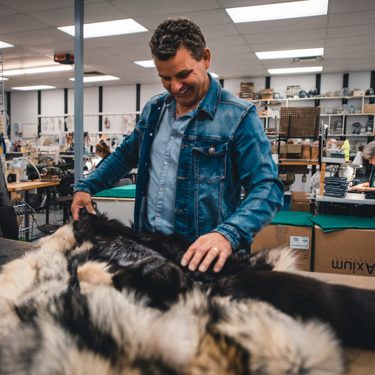 Bilodeau Canada - A man handling fur in a workshop