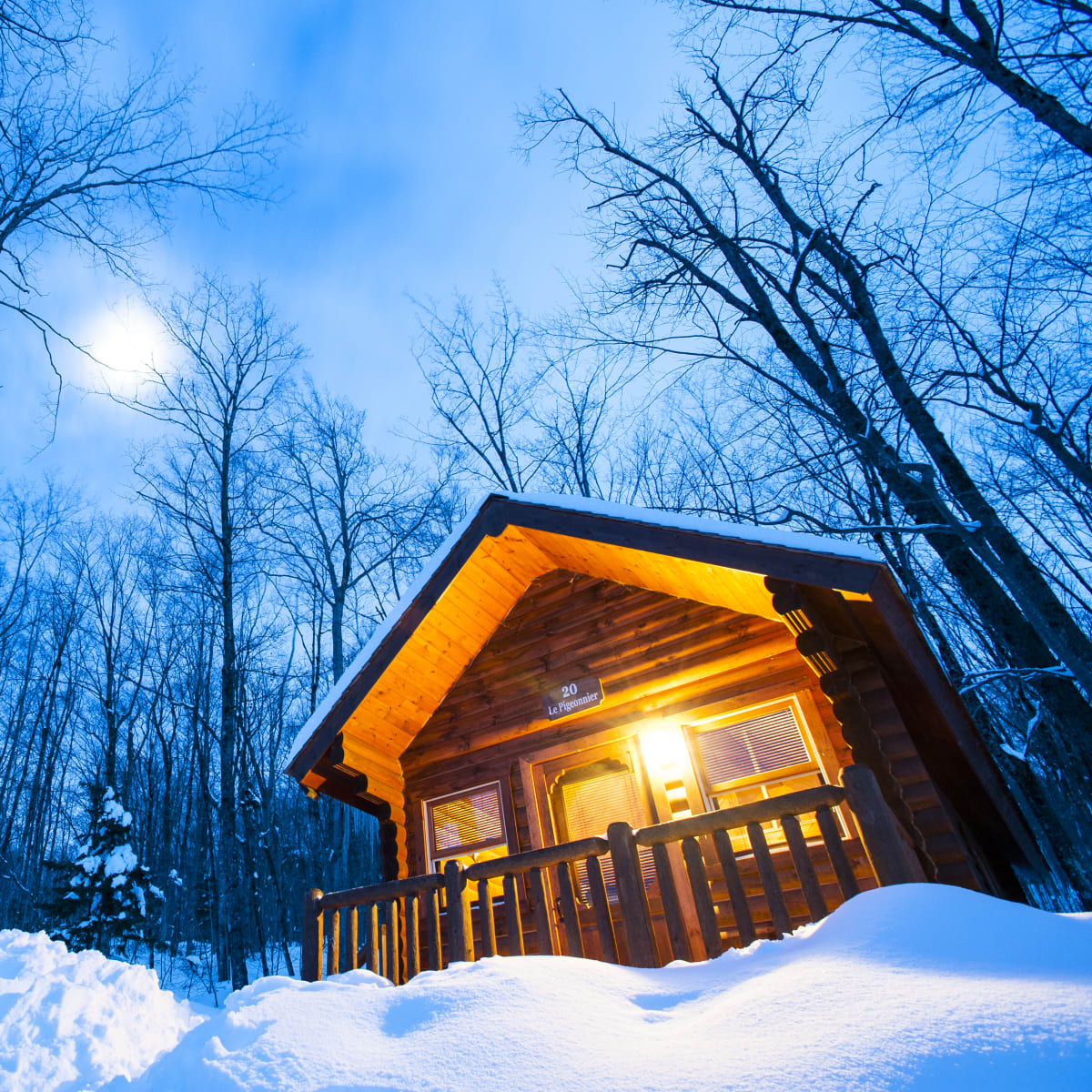 An illuminated cabin at Sommet Morin Heights.
