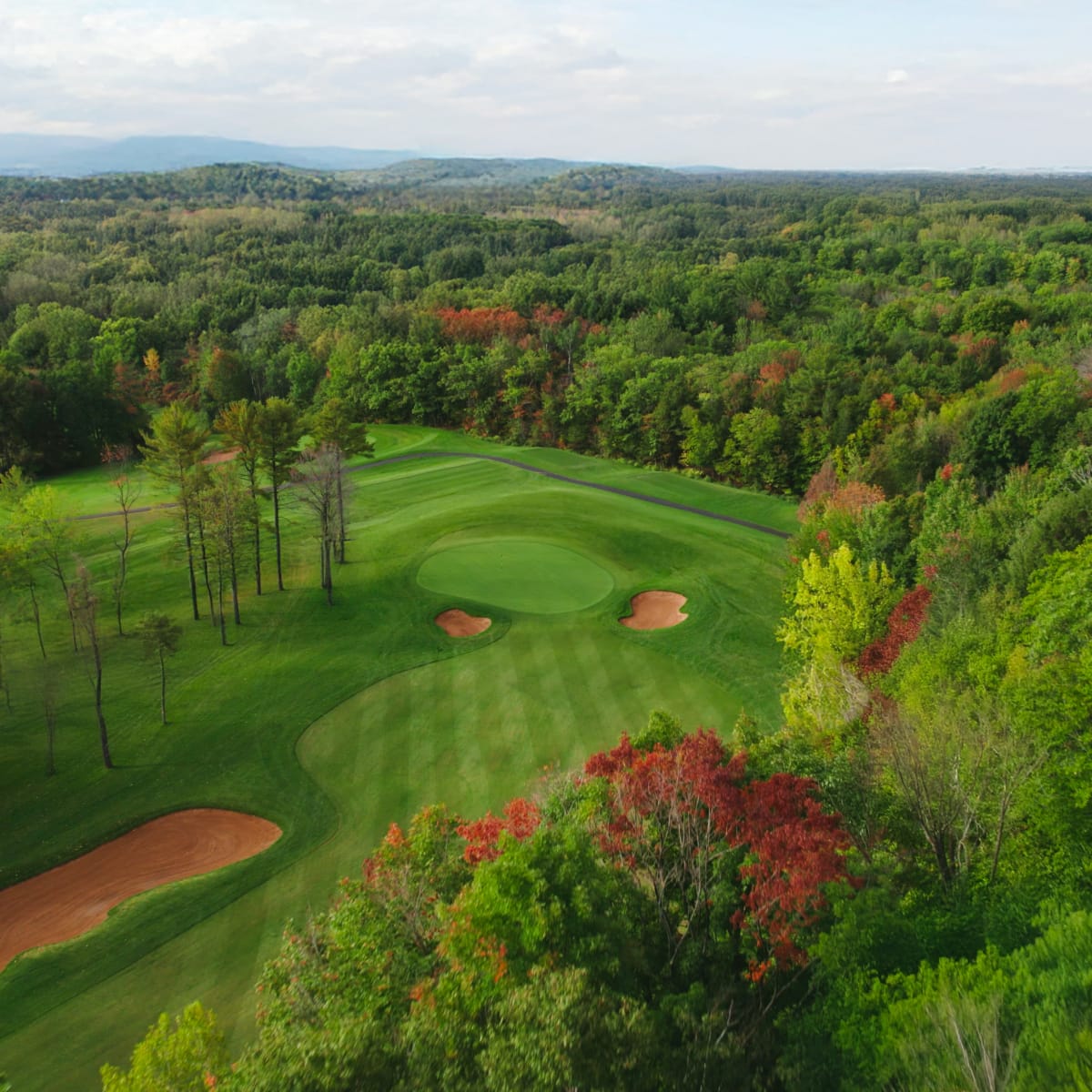 Aerial view of the Centre de Golf Le Versant in autumn.