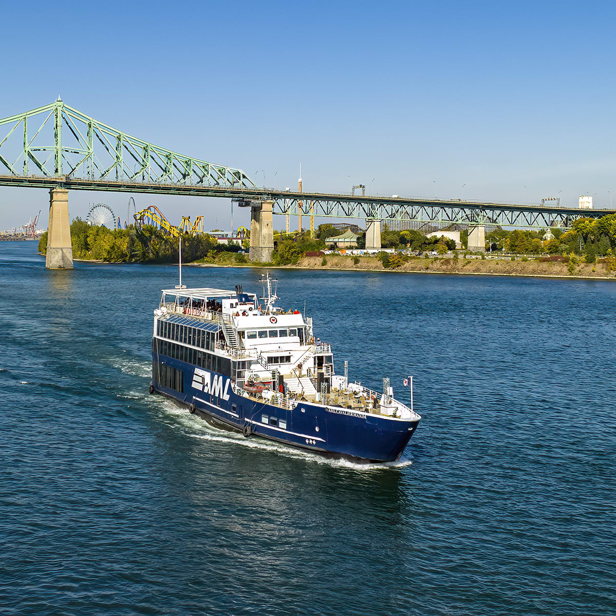 Cruise ship next to a bridge in Montréal.