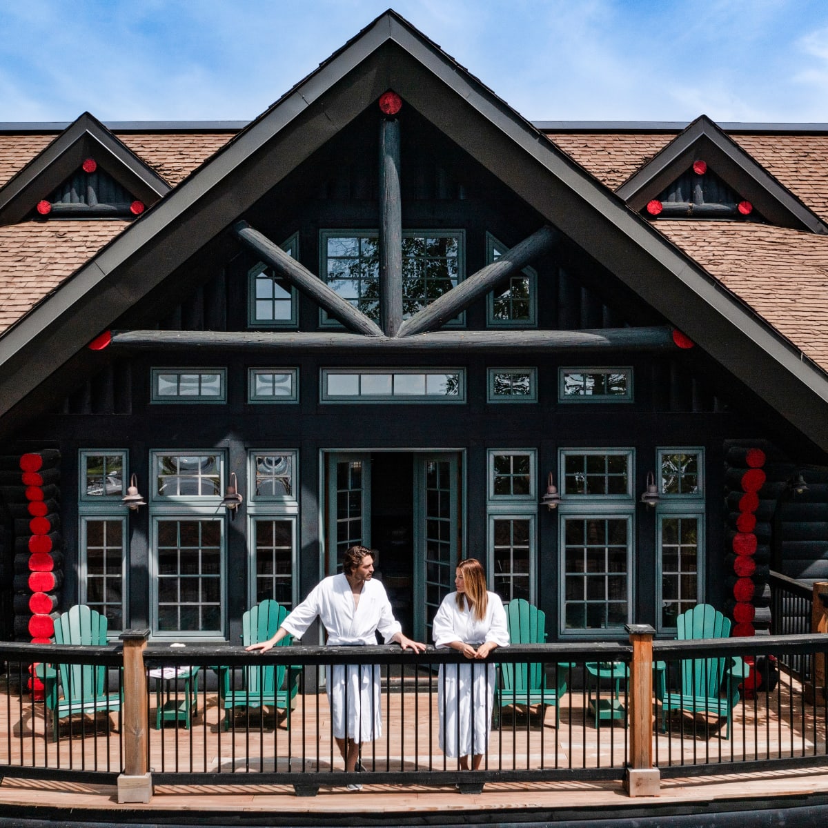 Couple on a balcony at Fairmont Le Château Montebello.