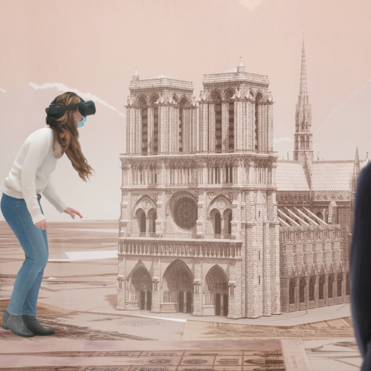 Eternal Notre-Dame - Two people wearing virtual reality headsets are looking at a cathedral.