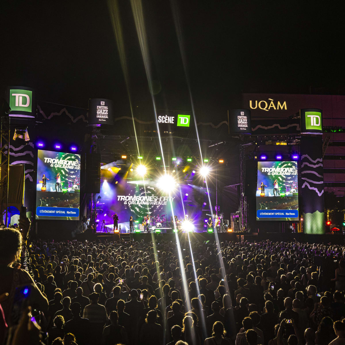 Crowd in front of a giant screen