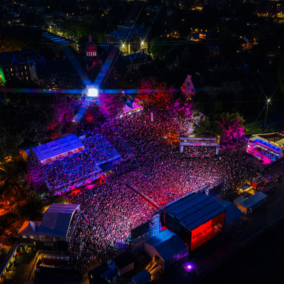Aerial view of the FestiVoix de Trois-Rivières at night.