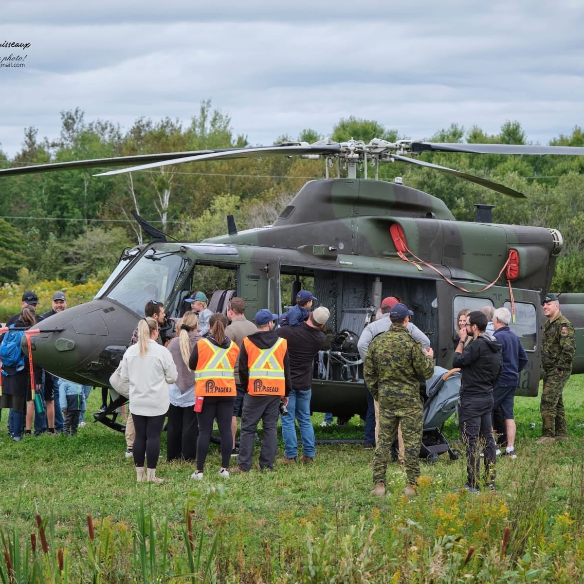 Festival-goers gathered around an army helicopter.