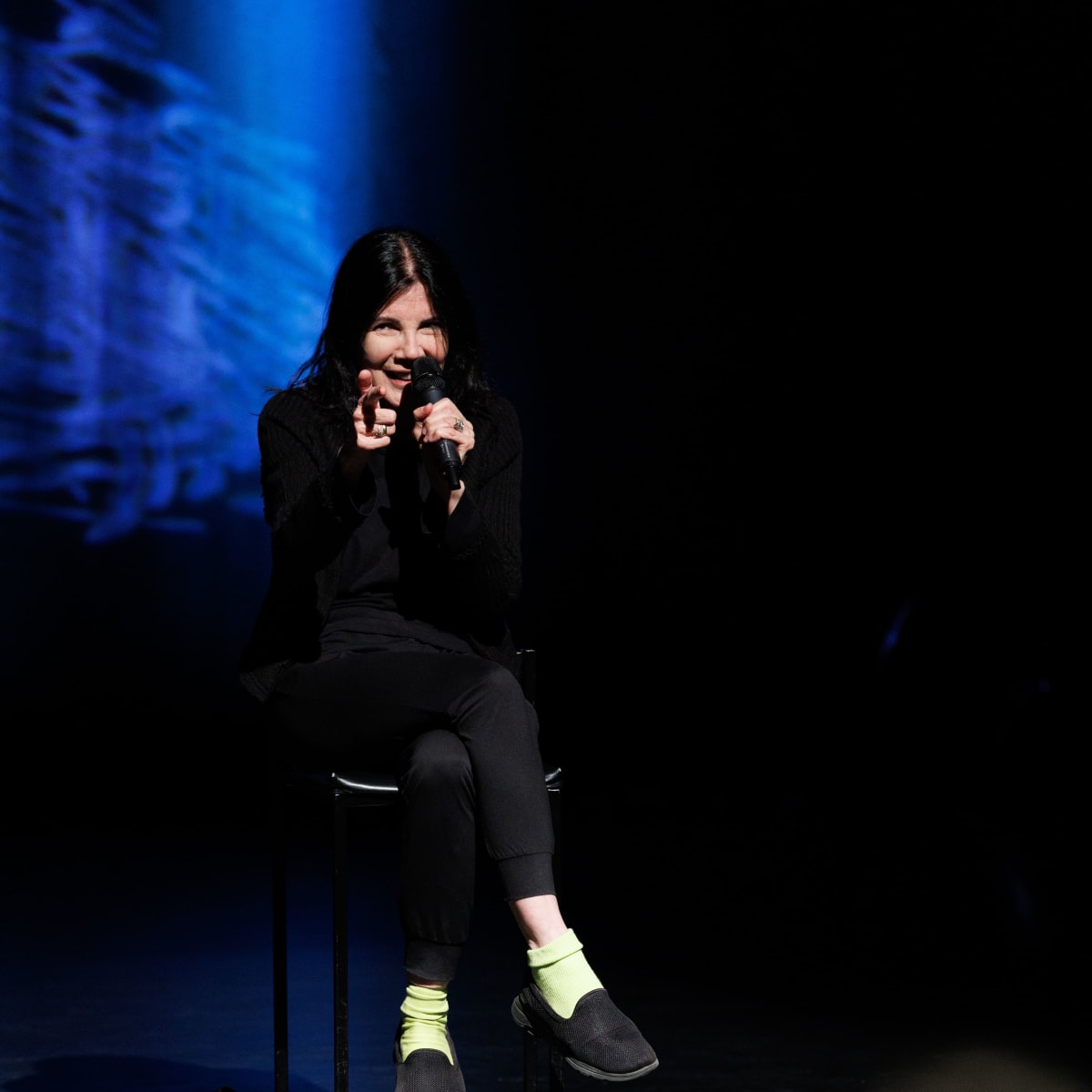 Carole Laure sitting on stage at the FFAVM.