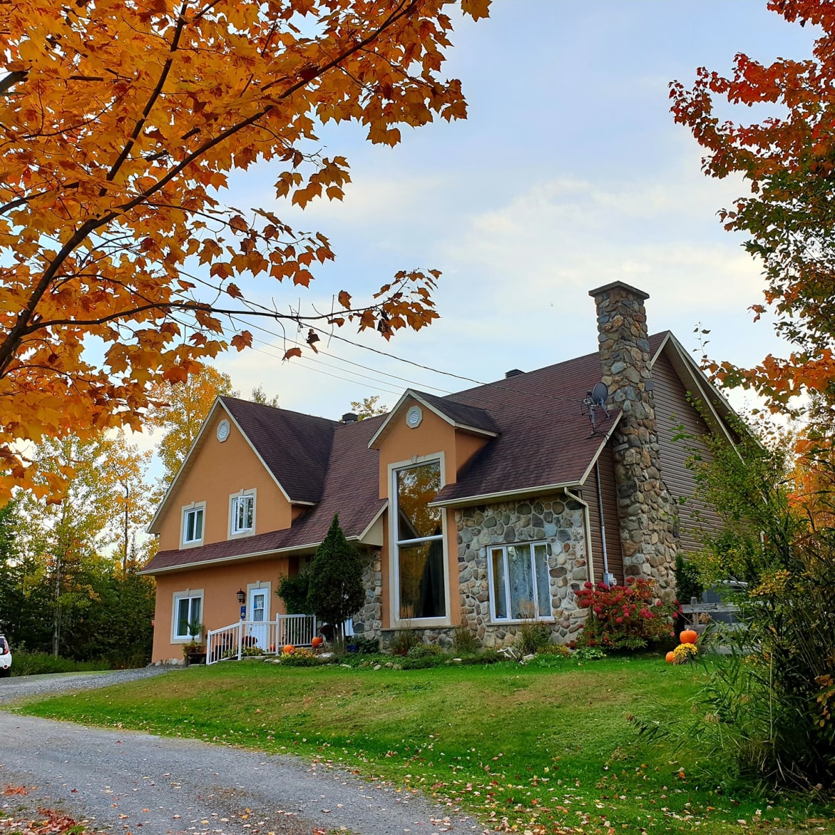 Exterior of the Gîte L'Antre d'Eux in autumn.