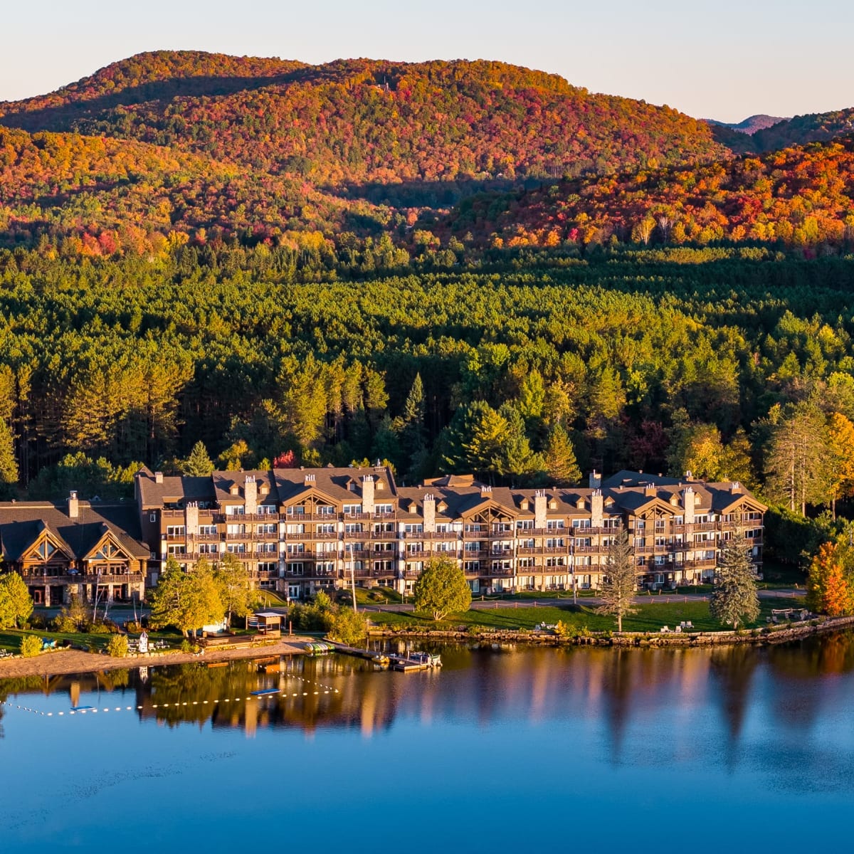 Aerial view of the hotel and the lake in the fall.