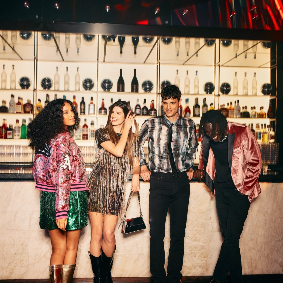 A group of friends in front of a bar.