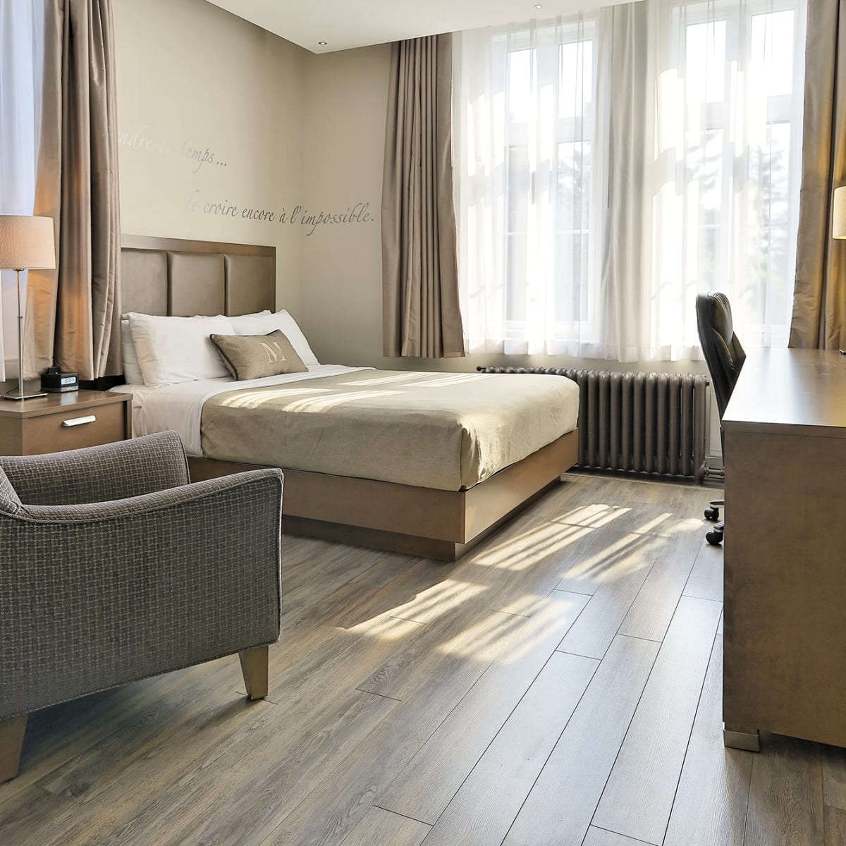 Bright hotel room with a modern, minimalist design.