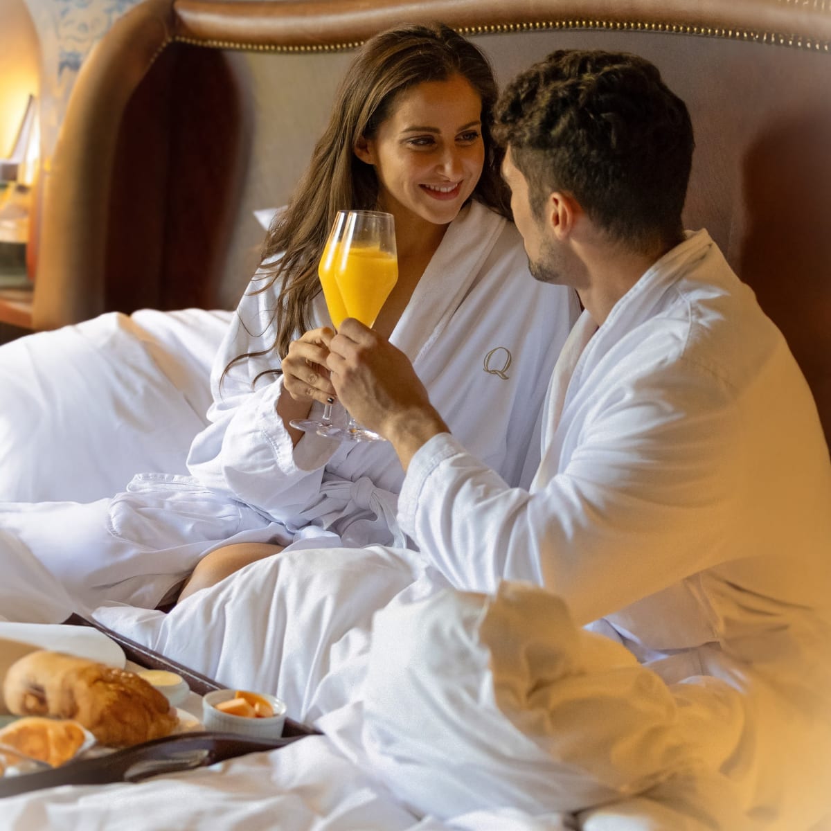 A couple and breakfast in bed.