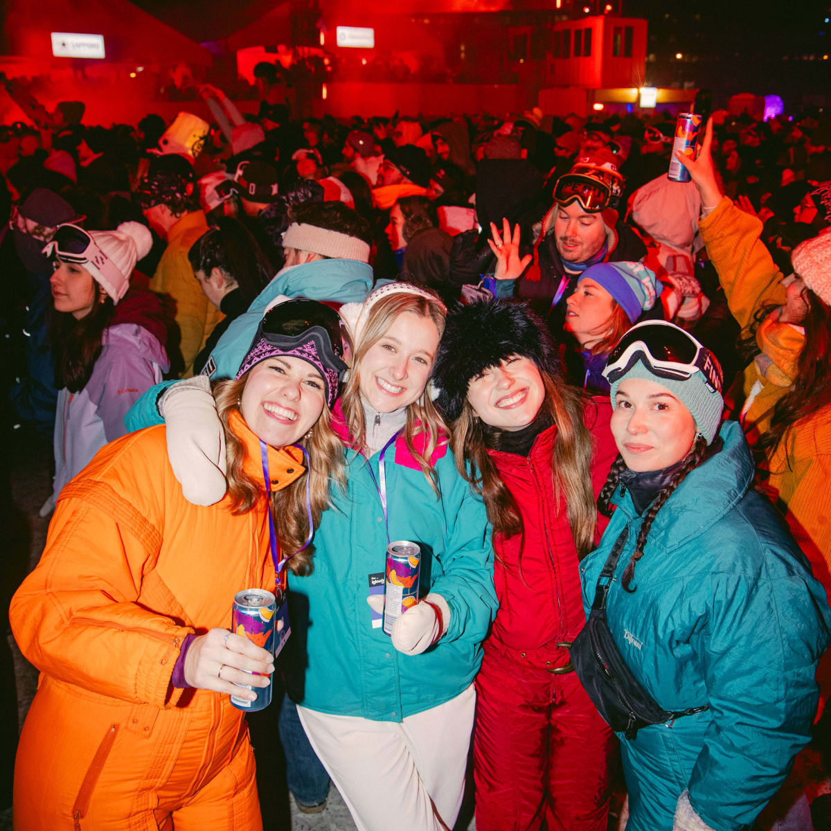 A group of cheerful women in the crowd.