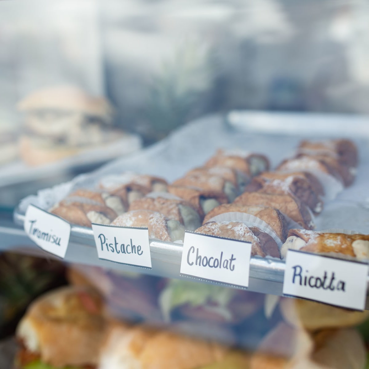 Cannoli in a display window at italfestMTL.