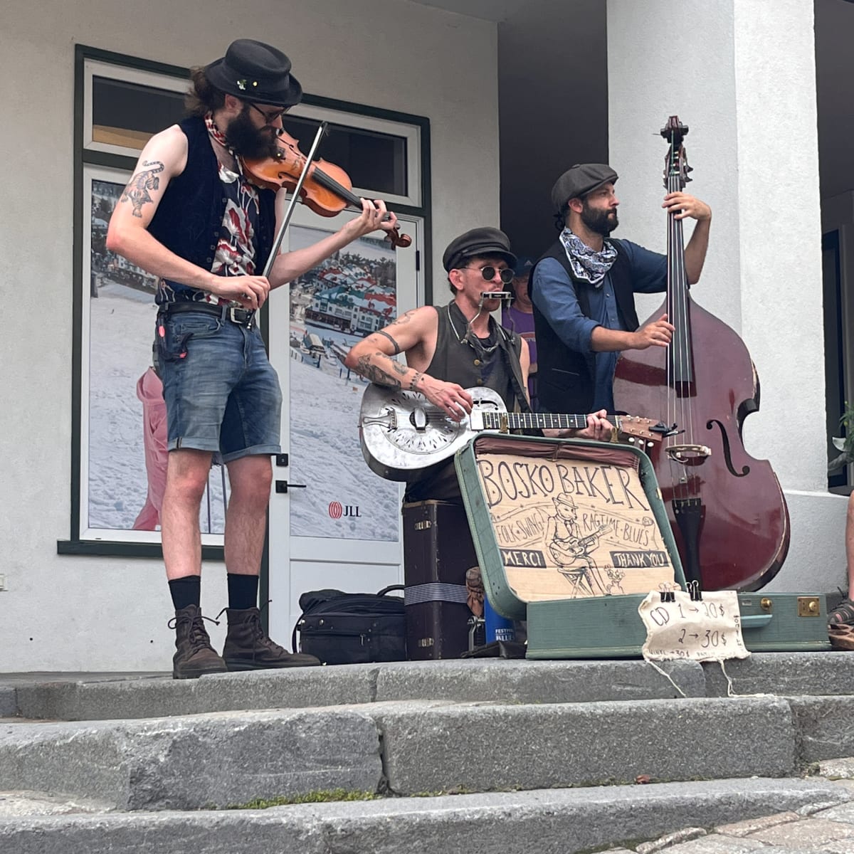 Three jazz or blues musicians on the street.