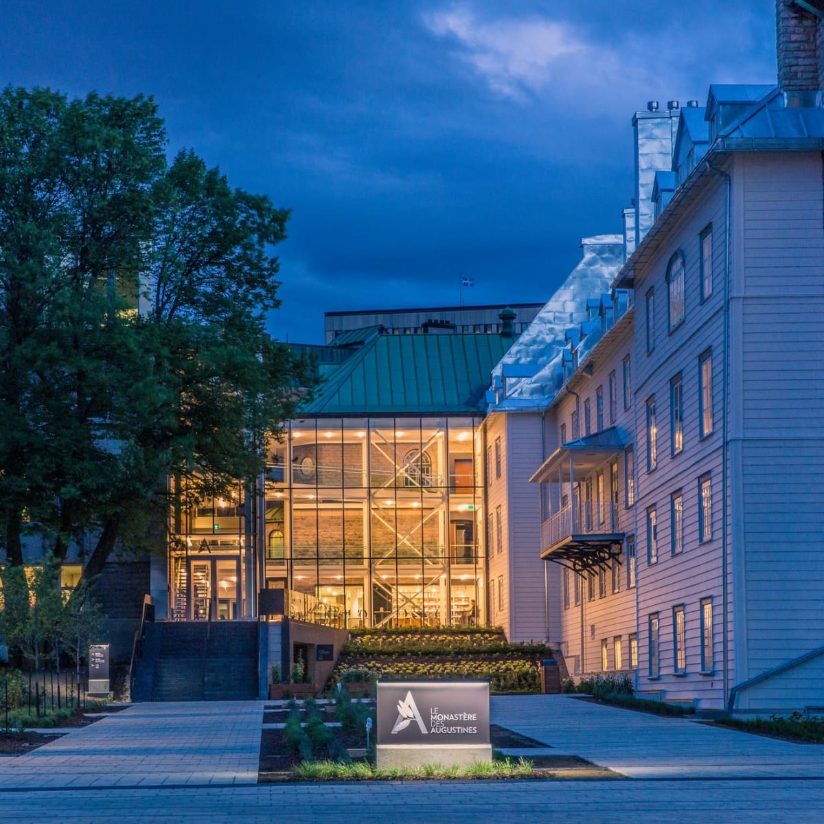 Exterior view of the Monastère des Augustines in the evening.