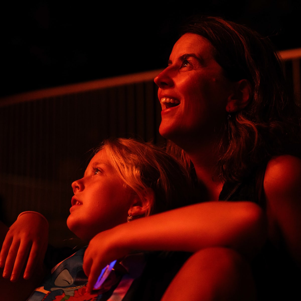 A mother and her kid looking at fireworks at Les Grands Feux du Casino Lac-Leamy.