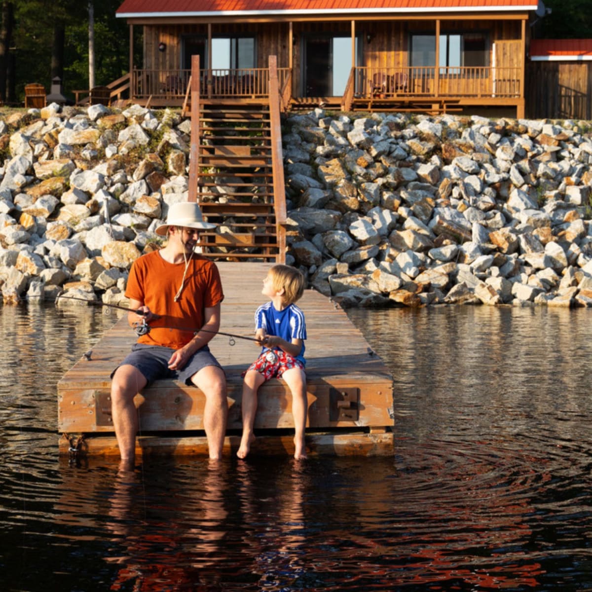 Father and son fishing in an outfitter in the Laurentians.