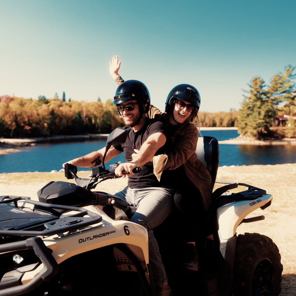 Couple on an ATV in an outfitter in the Laurentians.