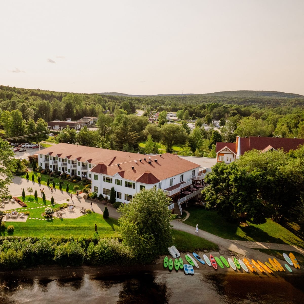 Aerial view of Manoir du Lac William in summer.