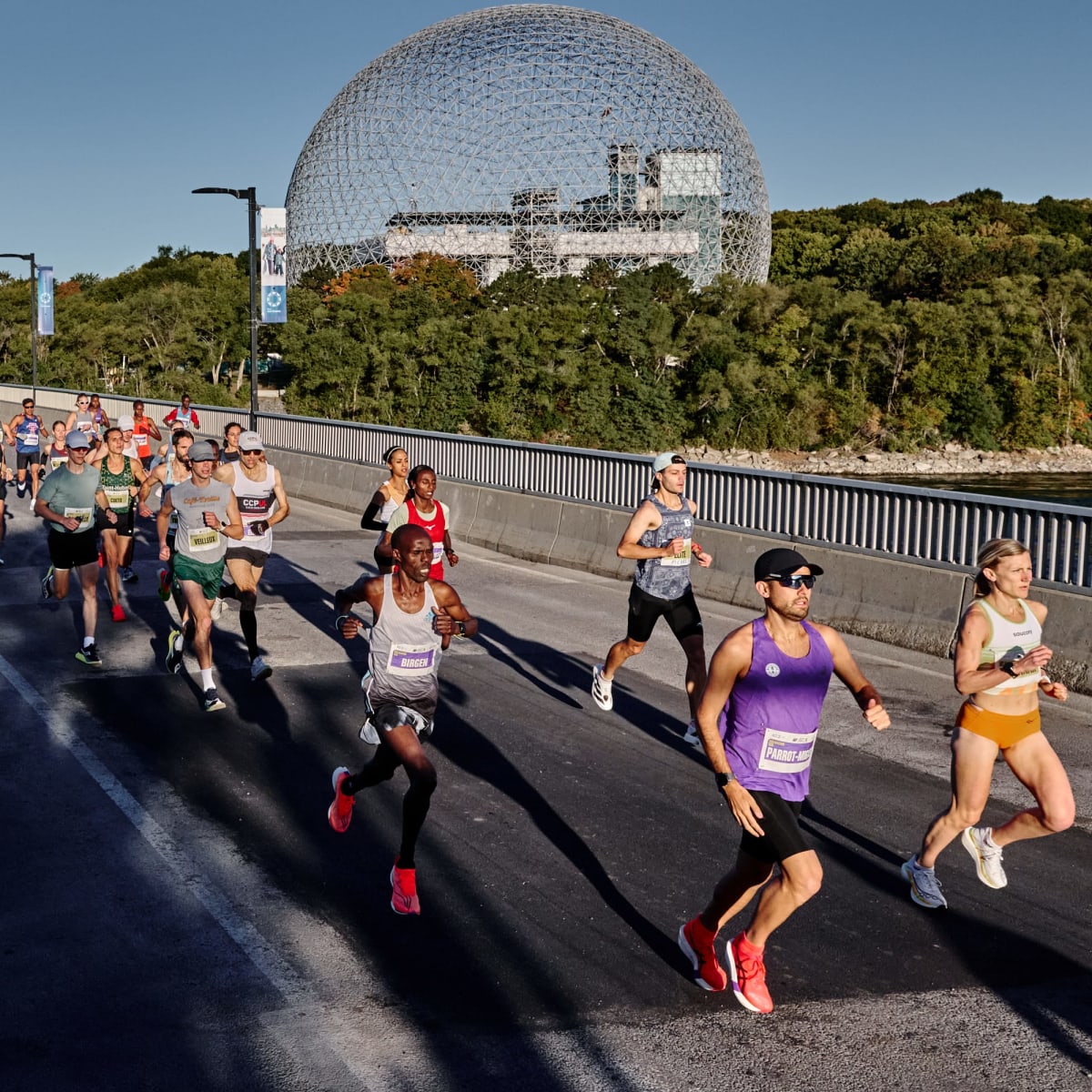 Runners on a bridge at Marathon Beneva de Montréal.