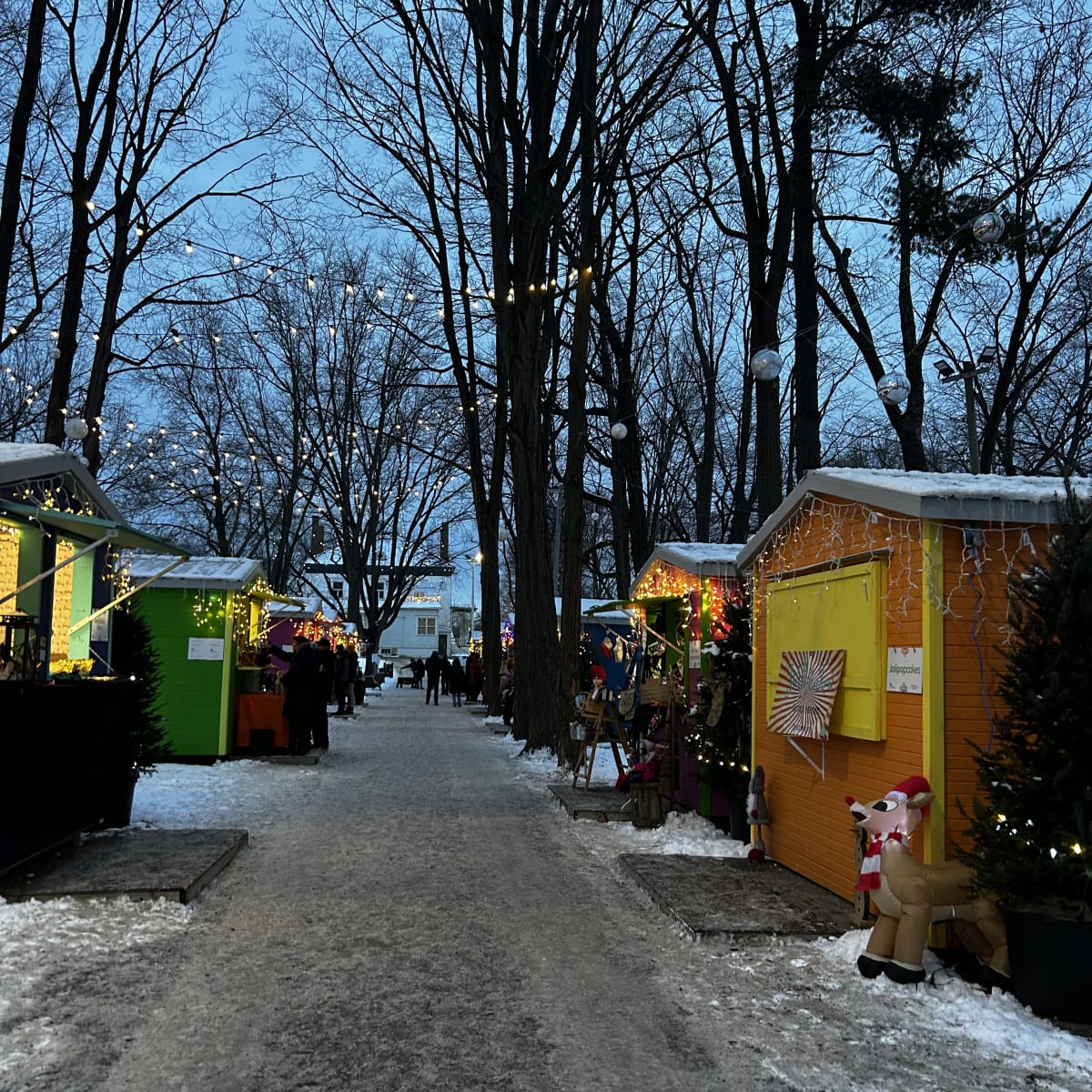 The Old Saint-Eustache Christmas Market lit up in the evening.