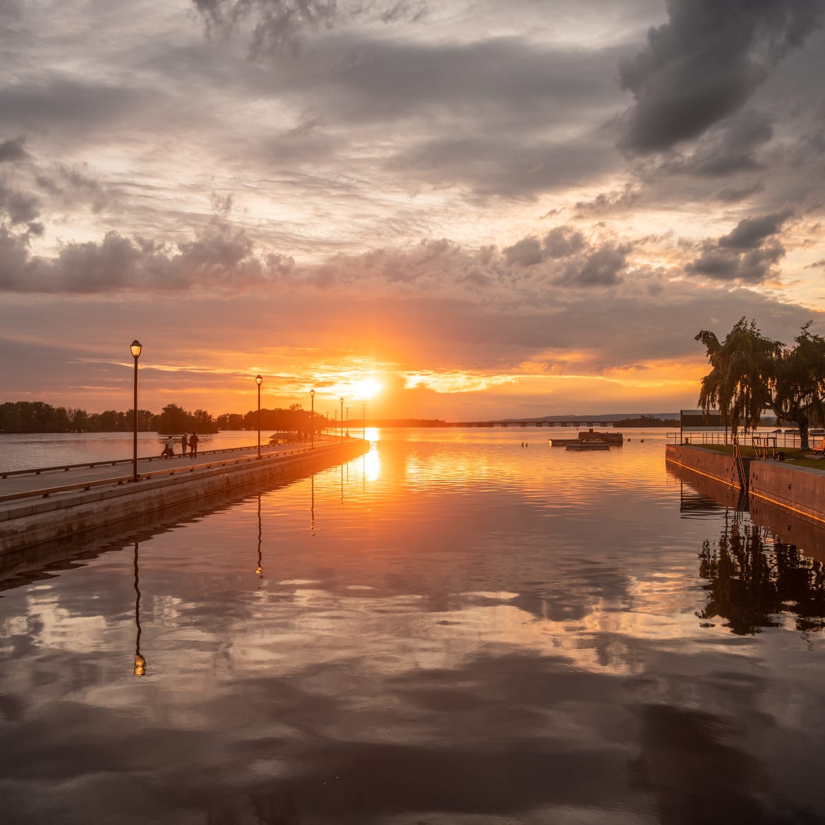 Escape close to home in Sainte-Anne-de-Bellevue - Sunset over the Promenade du canal boardwalk