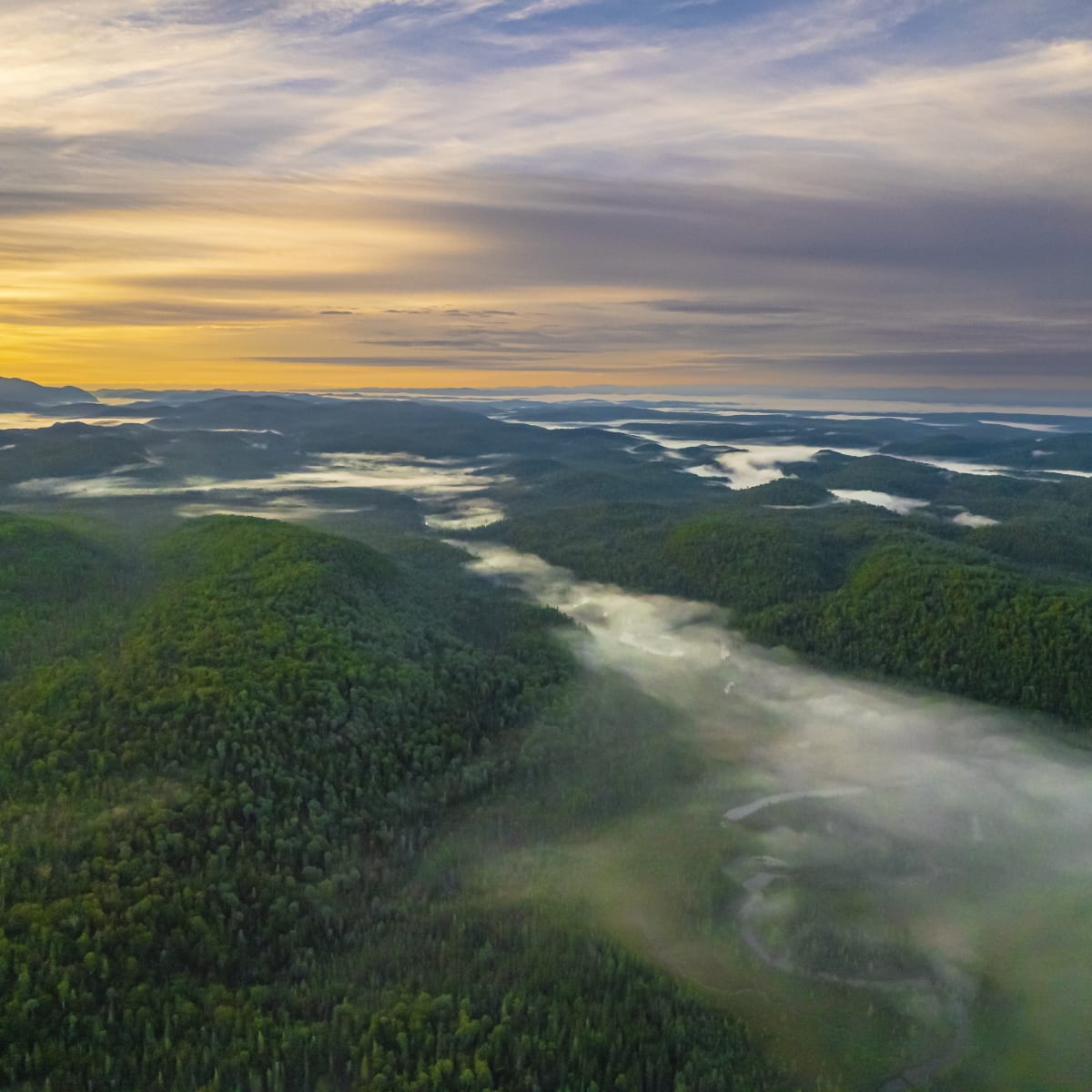 Your adventure begins in Saguenay–Lac-Saint-Jean - Mountainous landscape at sunset