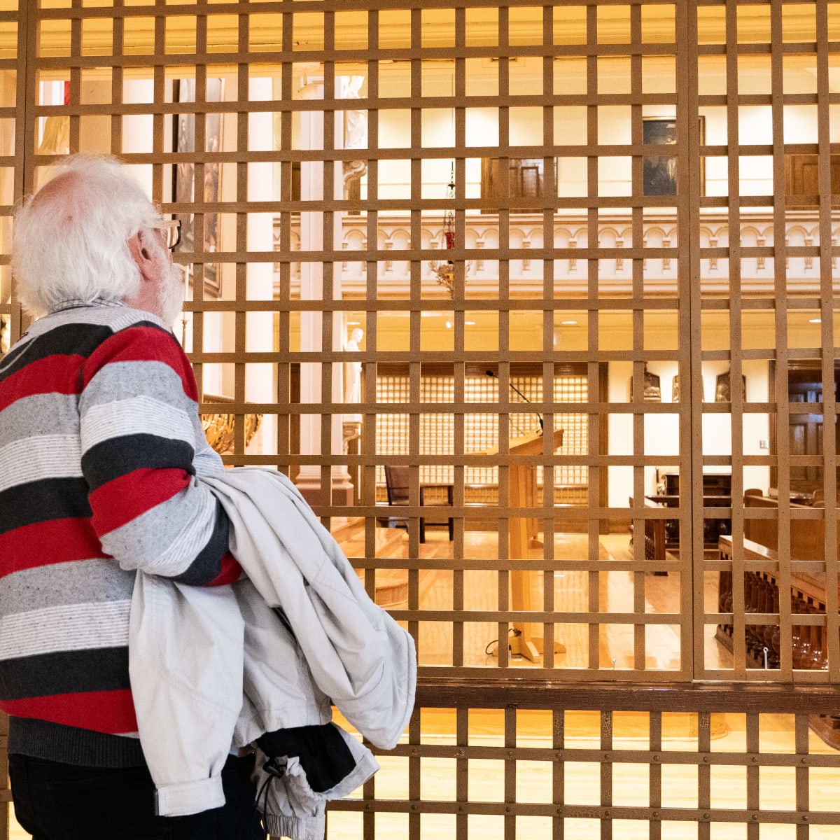 Man visiting the Musée des Ursulines de Trois-Rivières.