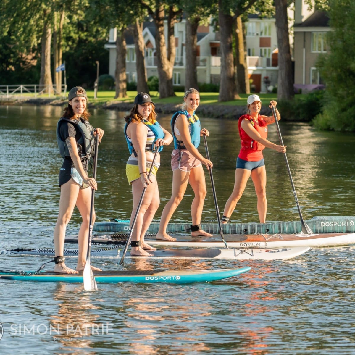 Women paddleboarding.