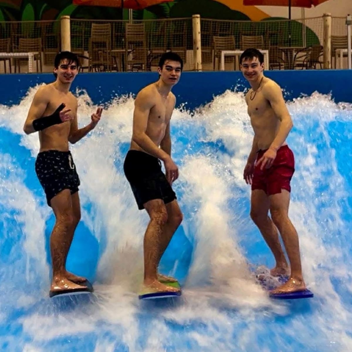 3 surfers at the Roi du Surf pool.