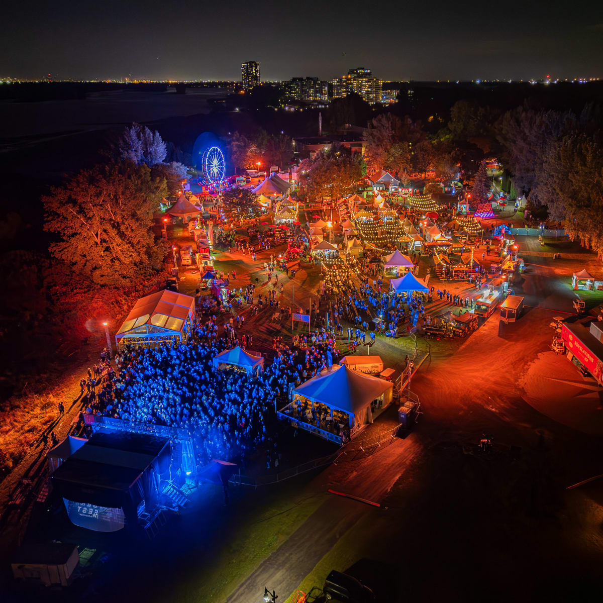 Aerial view of the Oktoberfest de Repentigny, illuminated at night.