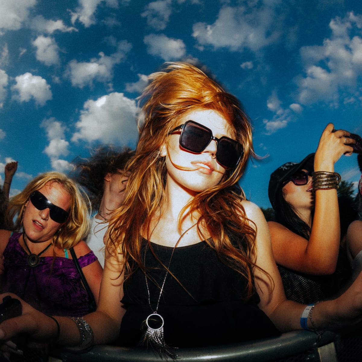 A woman dancing in the crowd.