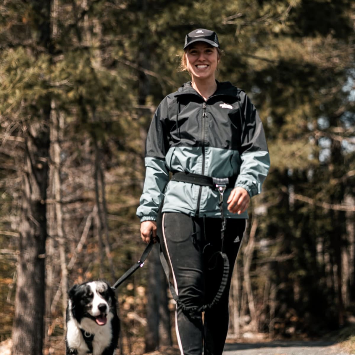 Person walking with a dog.